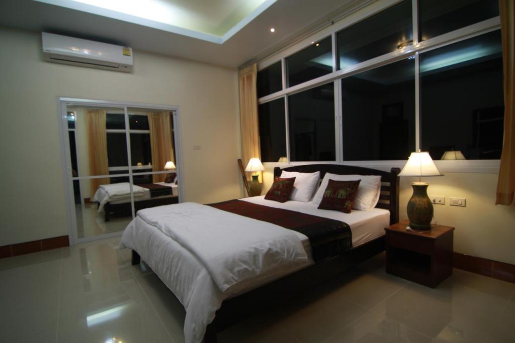 Postel nebo postele na pokoji v ubytování Mountain Resort Koh Lipe