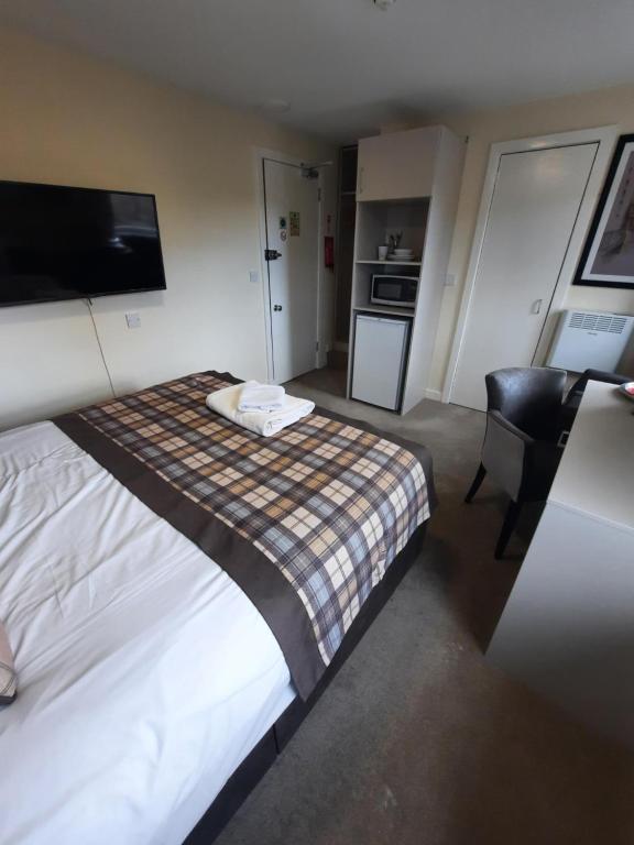 Postel nebo postele na pokoji v ubytování Dalkeith Aparthotel