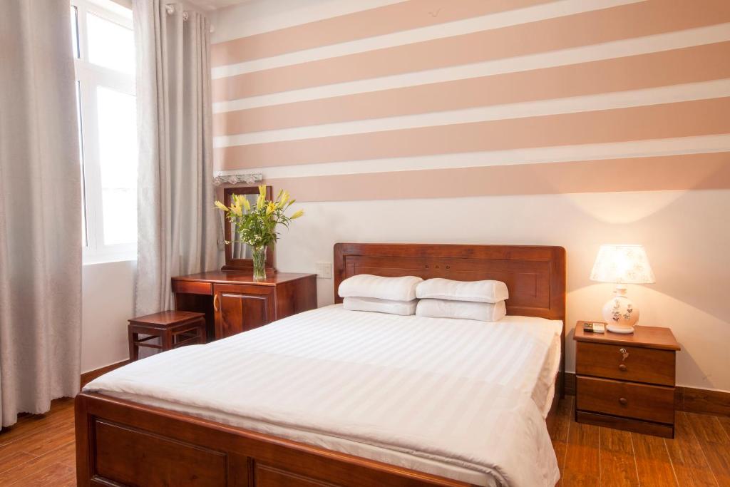 Giường trong phòng chung tại Phuong Nam Guest House