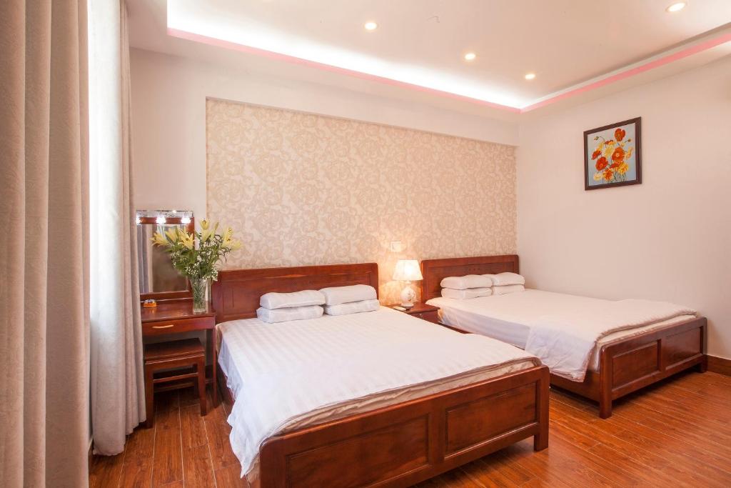 Giường trong phòng chung tại Phuong Nam Guest House