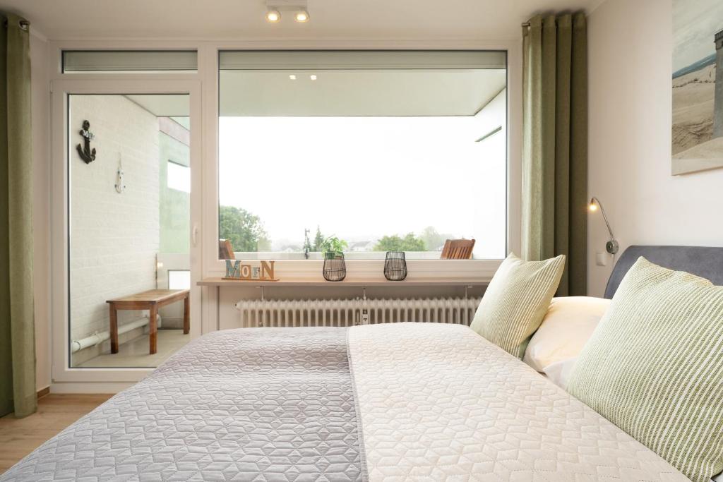 Postel nebo postele na pokoji v ubytování Driftberg 1 Wohnung 121