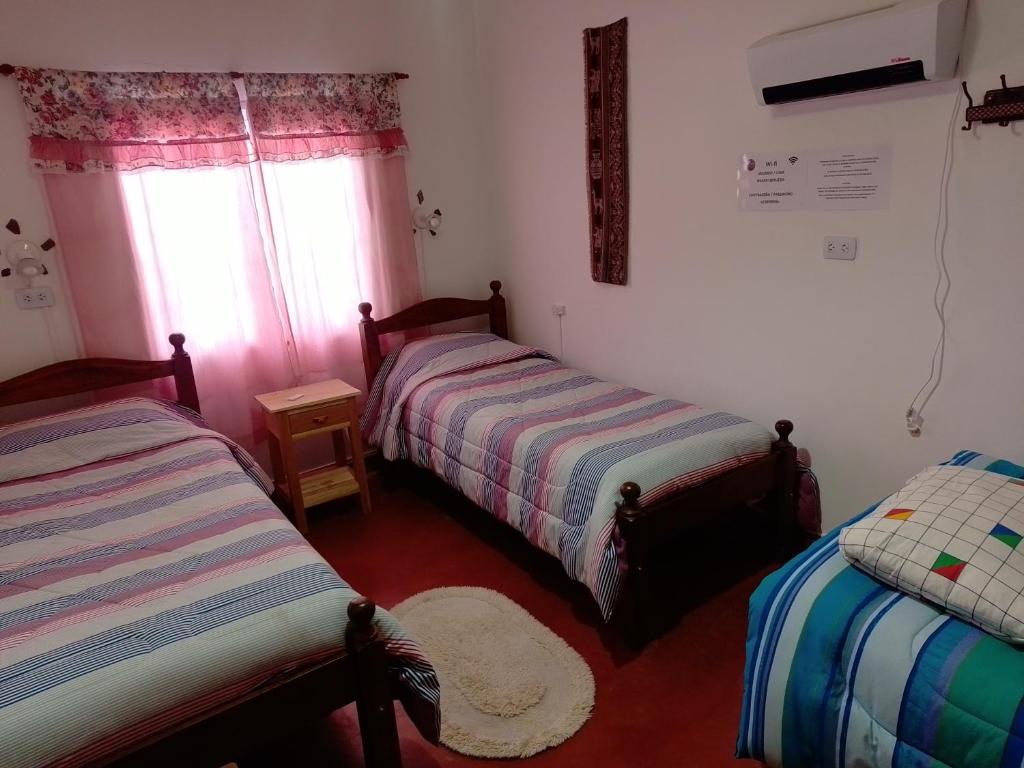 Postel nebo postele na pokoji v ubytování La Candelaria