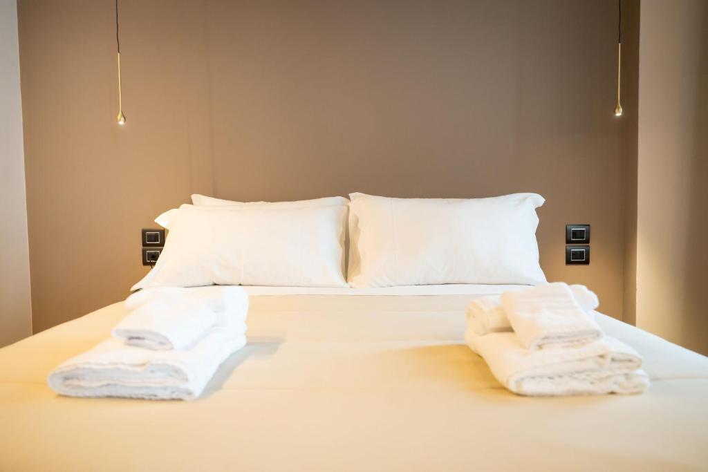 Postel nebo postele na pokoji v ubytování Didimos Town Hotel