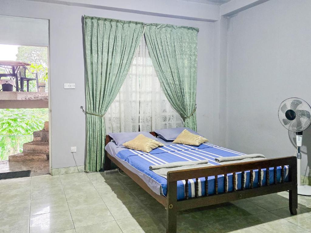 Postel nebo postele na pokoji v ubytování The Brick House Kandy
