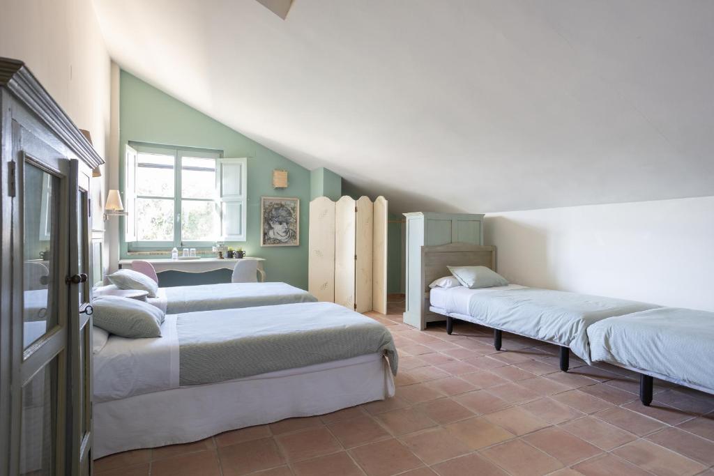 Postel nebo postele na pokoji v ubytování Hotel Boutique Moli El Canyisset