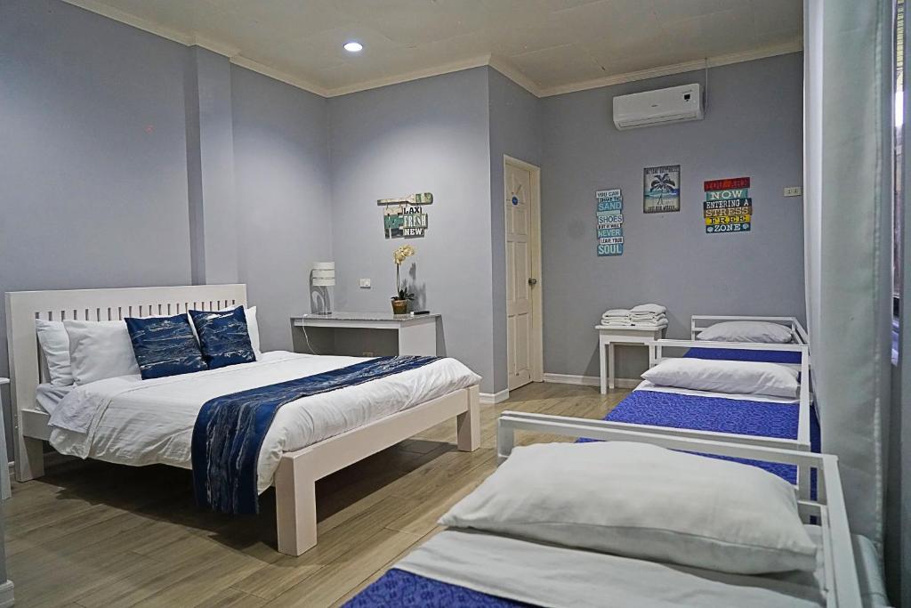 a hospital room with two beds and two tables at Bella Vista Resort in Naguilian