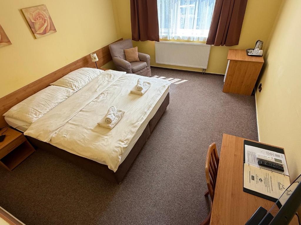 Postel nebo postele na pokoji v ubytování Penzión Bojnice