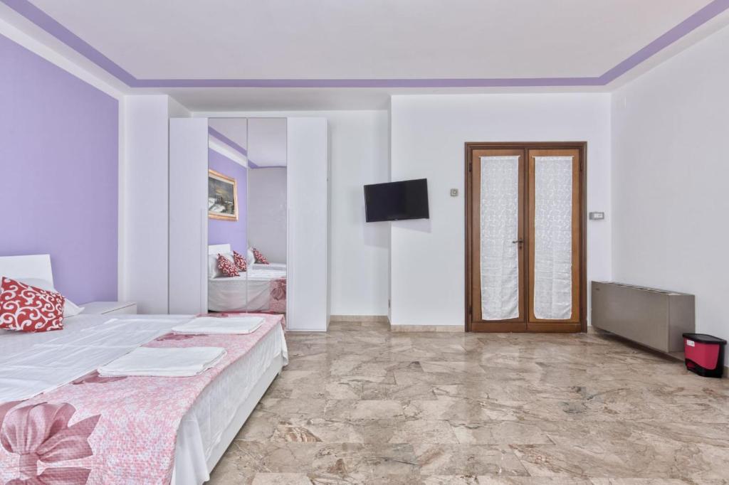 Postel nebo postele na pokoji v ubytování Venice Mahdi Apartment