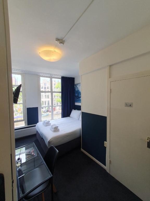Ein Bett oder Betten in einem Zimmer der Unterkunft Hotel Hoksbergen