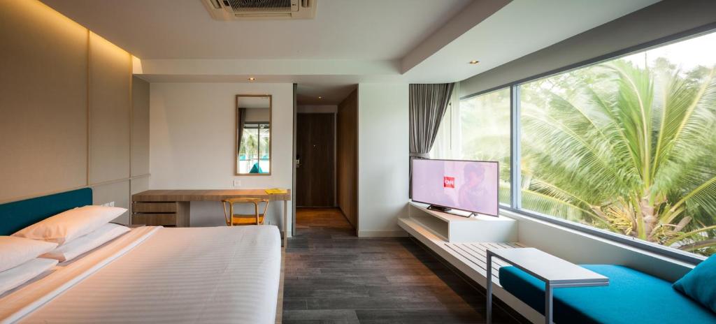 TV a/nebo společenská místnost v ubytování Bann Pantai Resort