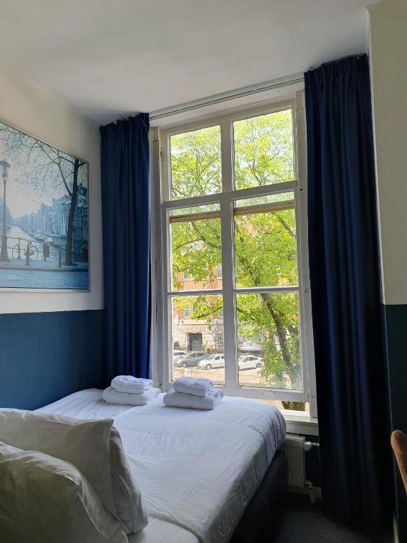 Ein Bett oder Betten in einem Zimmer der Unterkunft Hotel Hoksbergen