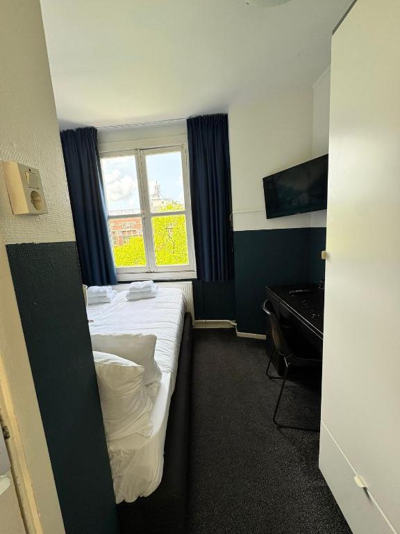 Ein Bett oder Betten in einem Zimmer der Unterkunft Hotel Hoksbergen