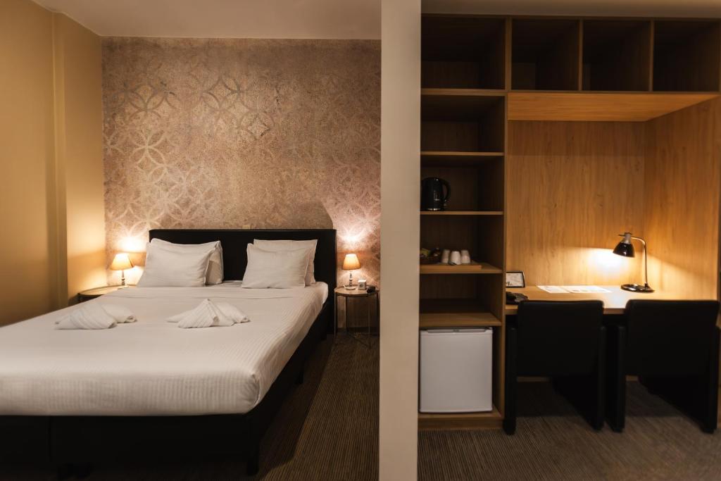 Postel nebo postele na pokoji v ubytování Hotel Orion