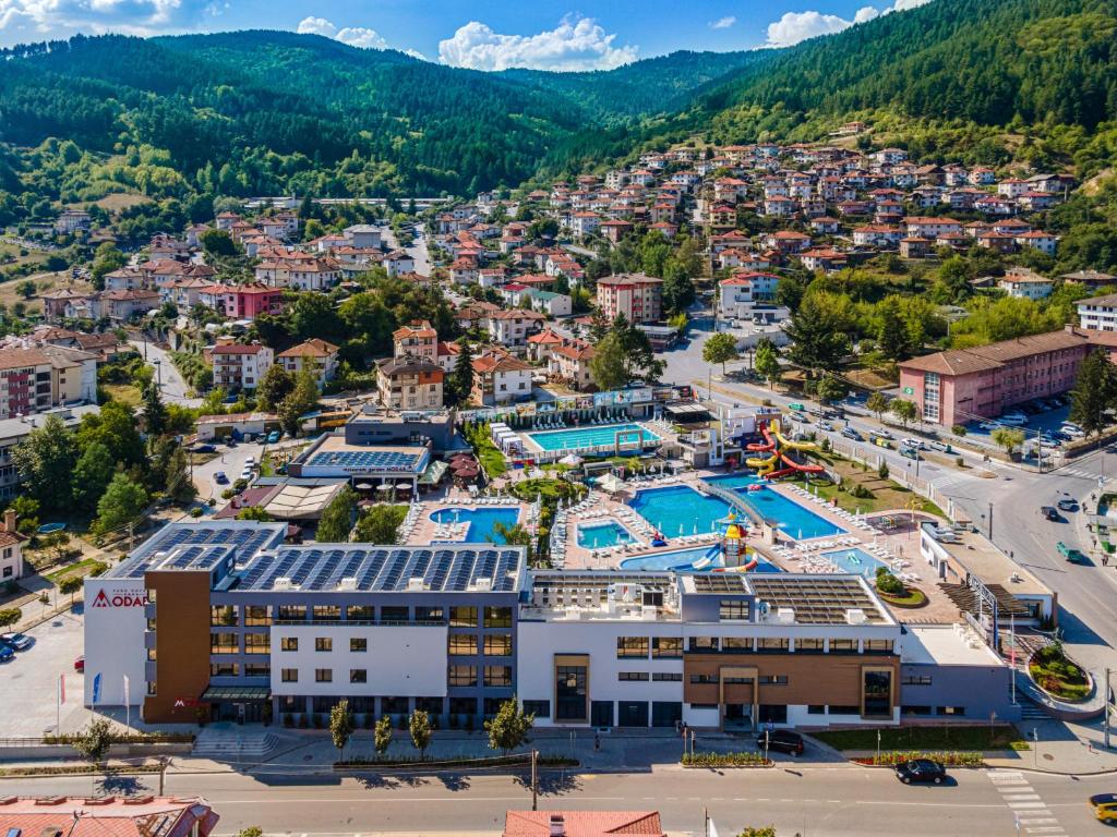 an aerial view of a resort with a swimming pool at Парк Хотел Модър in Devin