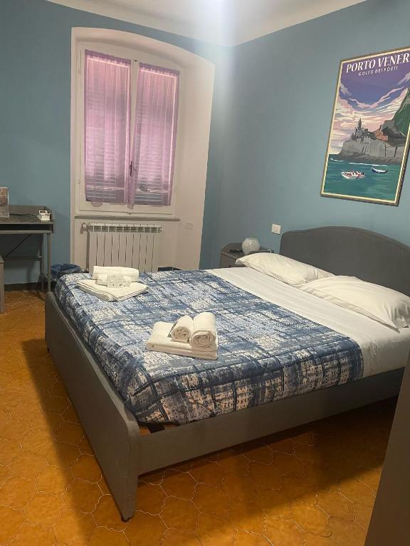 Postel nebo postele na pokoji v ubytování Ca' Du Beppino Portovenere Central Suite