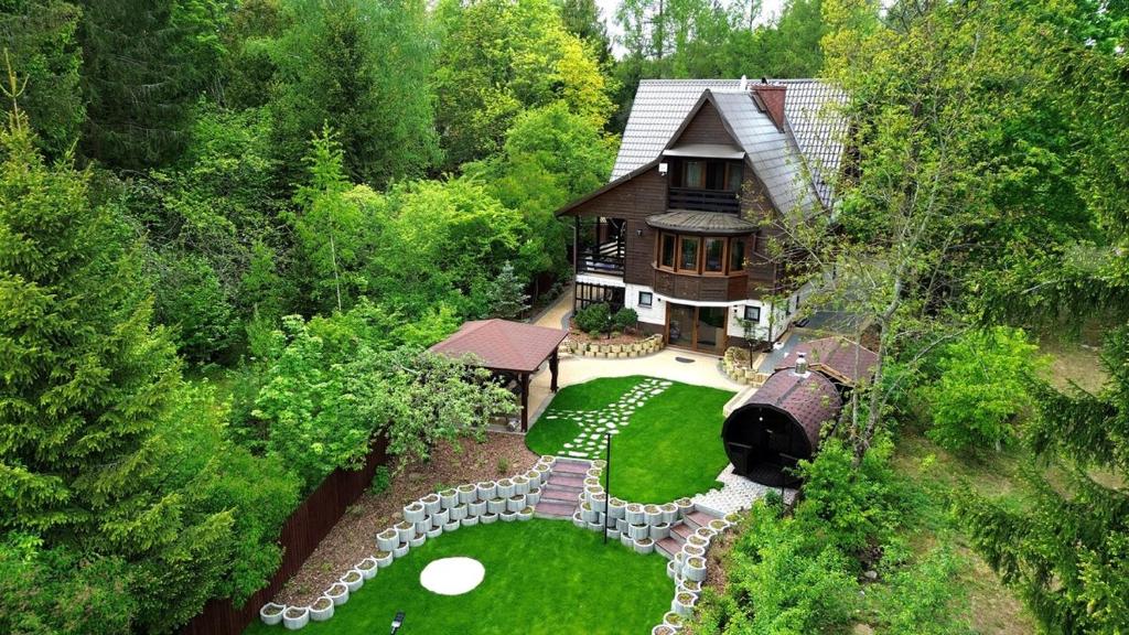 an aerial view of a house in the woods at Augustów Willa Sóweczka in Sucha Rzeczka