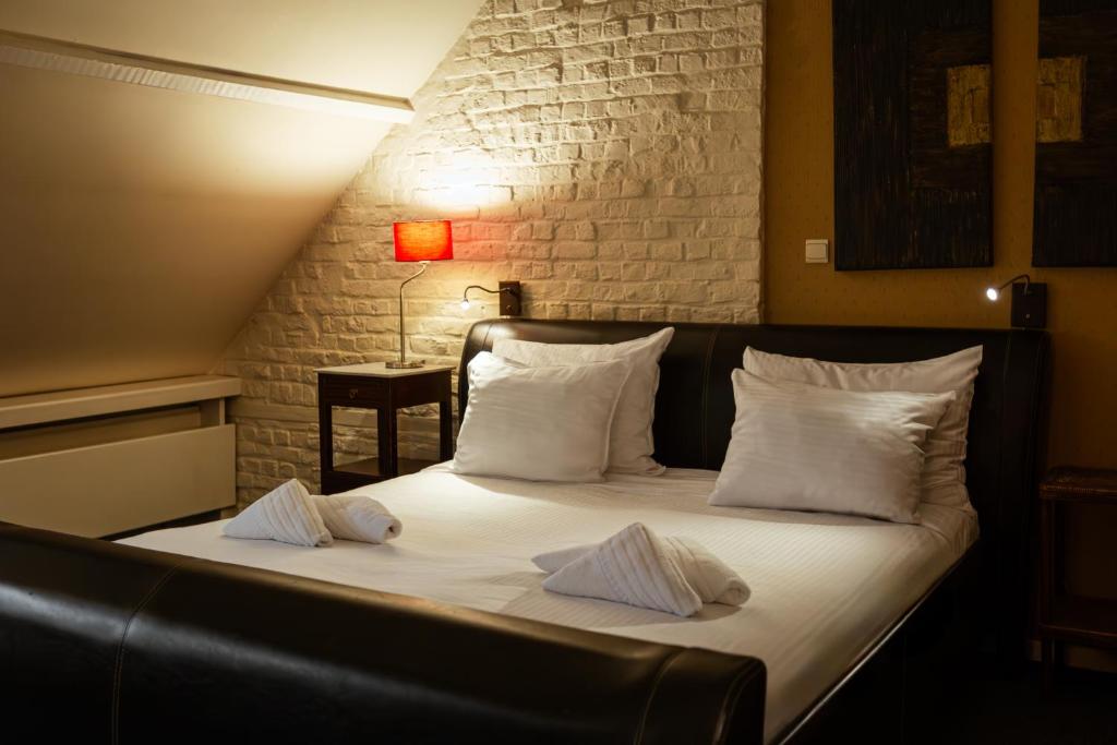 Postel nebo postele na pokoji v ubytování Hotel Orion