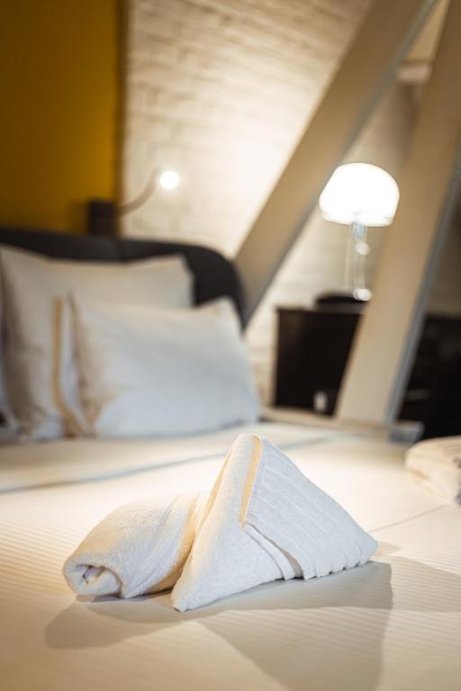 Postel nebo postele na pokoji v ubytování Hotel Orion