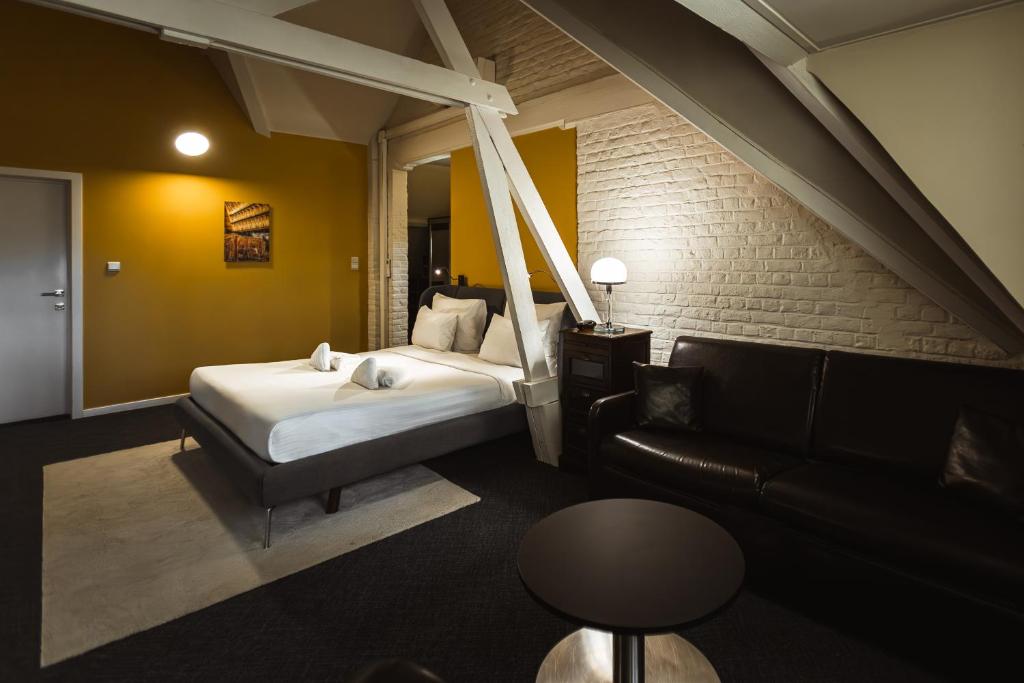 Postel nebo postele na pokoji v ubytování Hotel Orion