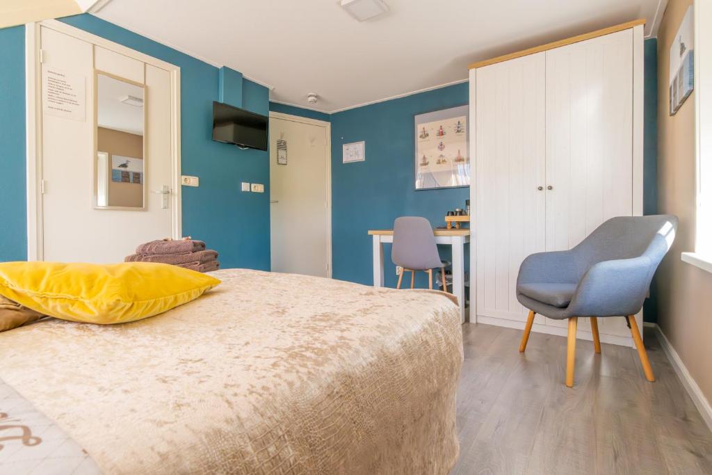 Postel nebo postele na pokoji v ubytování B&B Plompetorenzicht
