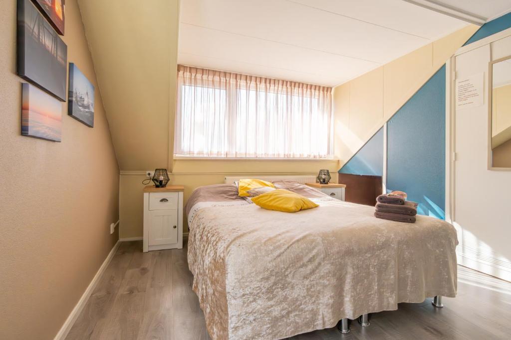 Postel nebo postele na pokoji v ubytování B&B Plompetorenzicht