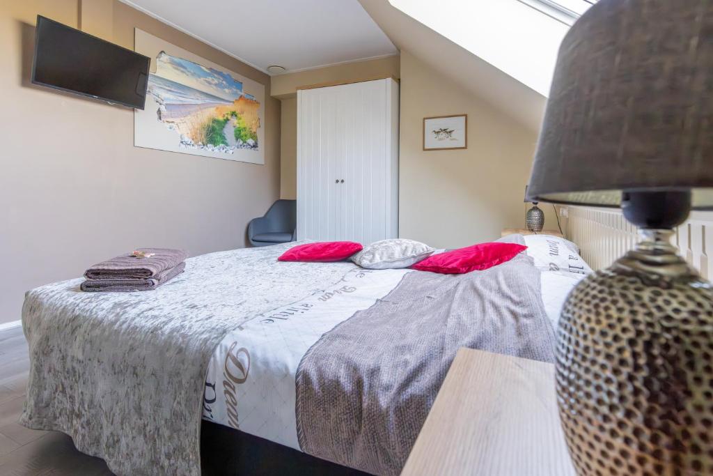 Postel nebo postele na pokoji v ubytování B&B Plompetorenzicht