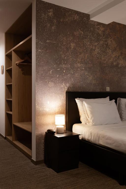 Postel nebo postele na pokoji v ubytování Hotel Orion