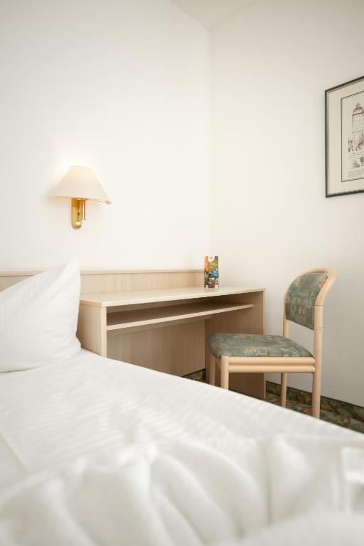 Postel nebo postele na pokoji v ubytování Hotel Astor