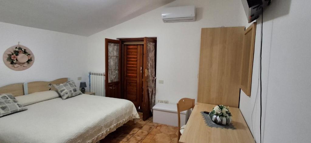 Postel nebo postele na pokoji v ubytování Hotel affittacamere novella