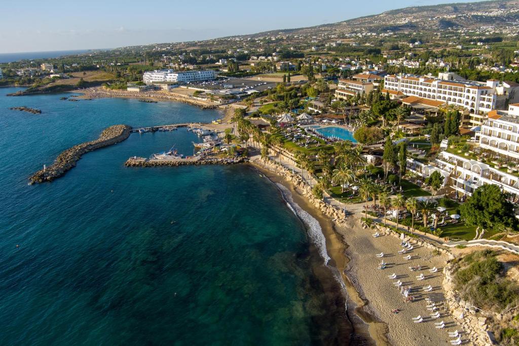 an aerial view of a beach and the ocean at Coral Beach Hotel & Resort Cyprus in Coral Bay