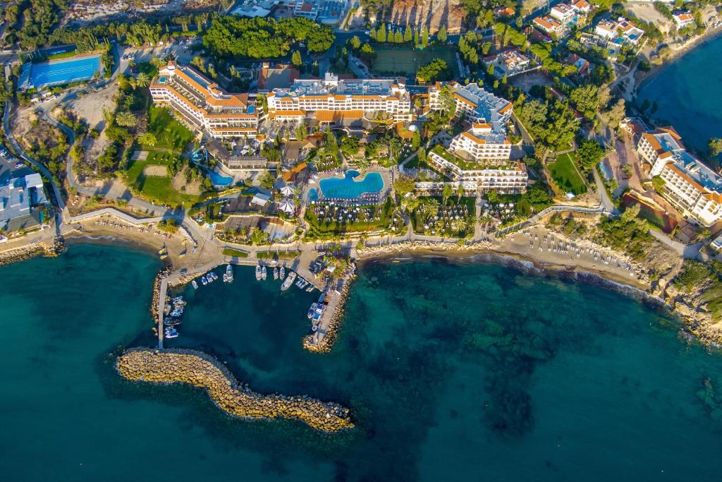 an aerial view of a resort near the water at Coral Beach Hotel & Resort Cyprus in Coral Bay