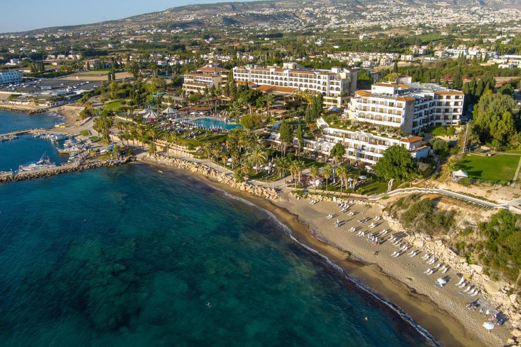 an aerial view of a resort and the beach at Coral Beach Hotel & Resort Cyprus in Coral Bay