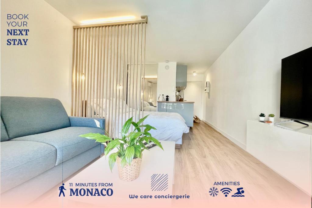 a living room with a couch and a tv at Splendid Studio With Swimming Pool Next To Monaco in Beausoleil