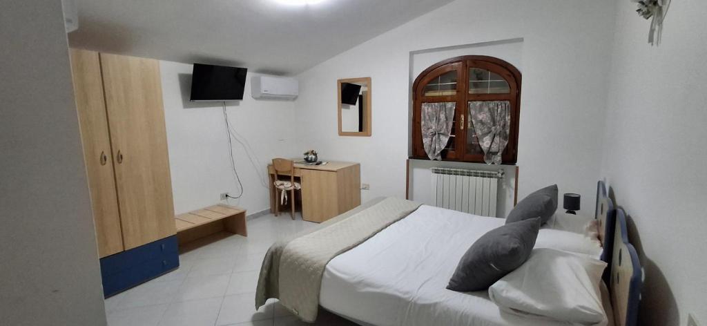 TV a/nebo společenská místnost v ubytování Hotel affittacamere novella