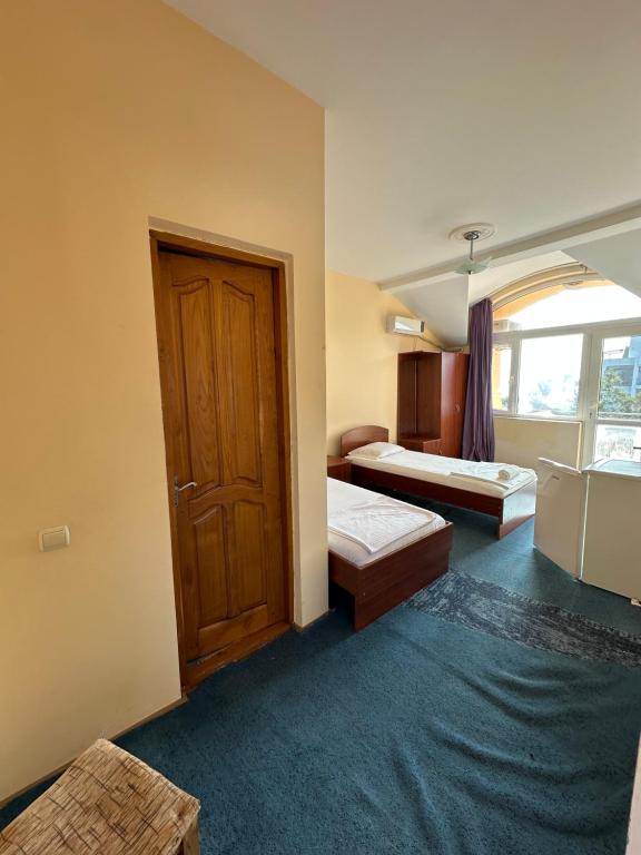 Postel nebo postele na pokoji v ubytování Hotel liza
