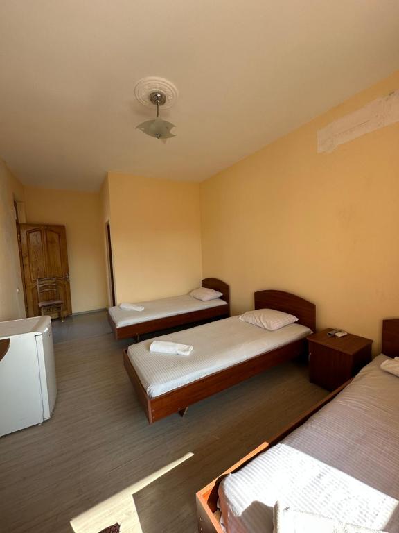 Postel nebo postele na pokoji v ubytování Hotel liza