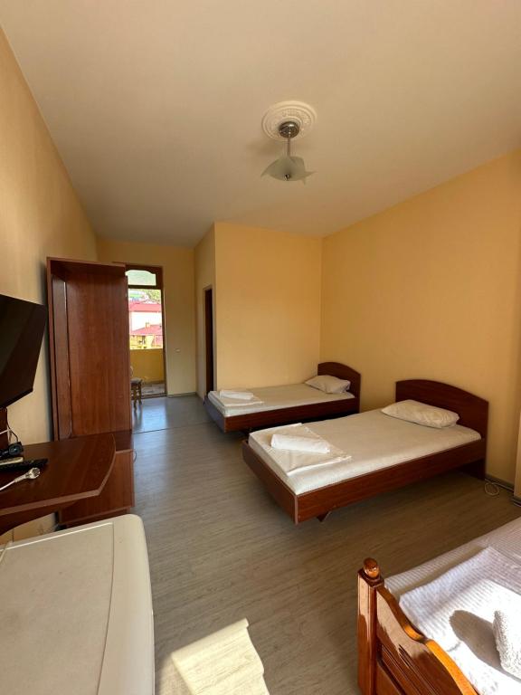 Postel nebo postele na pokoji v ubytování Hotel liza