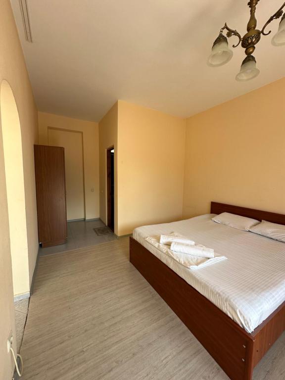 Postel nebo postele na pokoji v ubytování Hotel liza