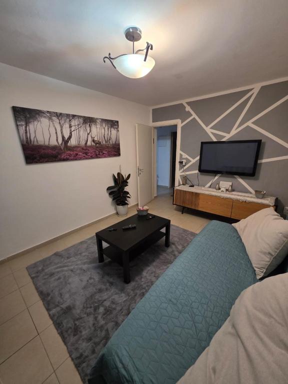 Postel nebo postele na pokoji v ubytování Jerusalem apartment