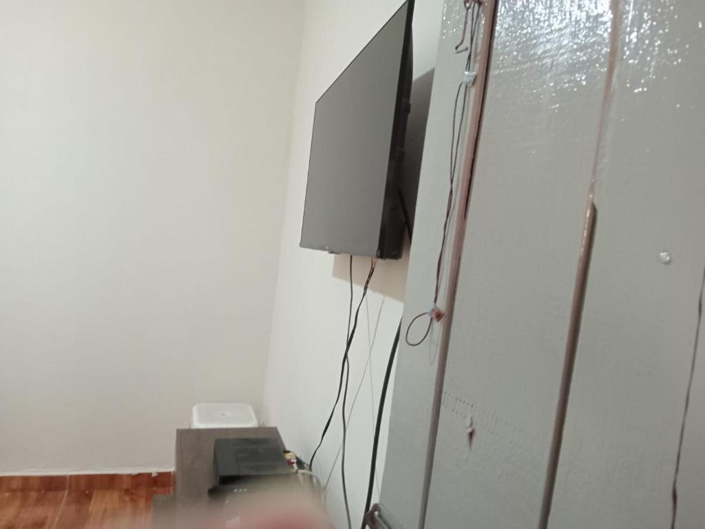 TV a/nebo společenská místnost v ubytování Casa a 400 metros da basilica