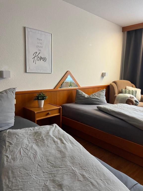 Ένα ή περισσότερα κρεβάτια σε δωμάτιο στο Messe Lodge - Schwand - Nürnberg