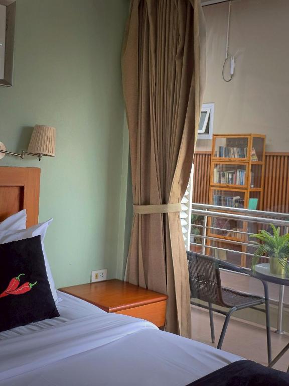 Postel nebo postele na pokoji v ubytování Chilli Hotel&Restaurant