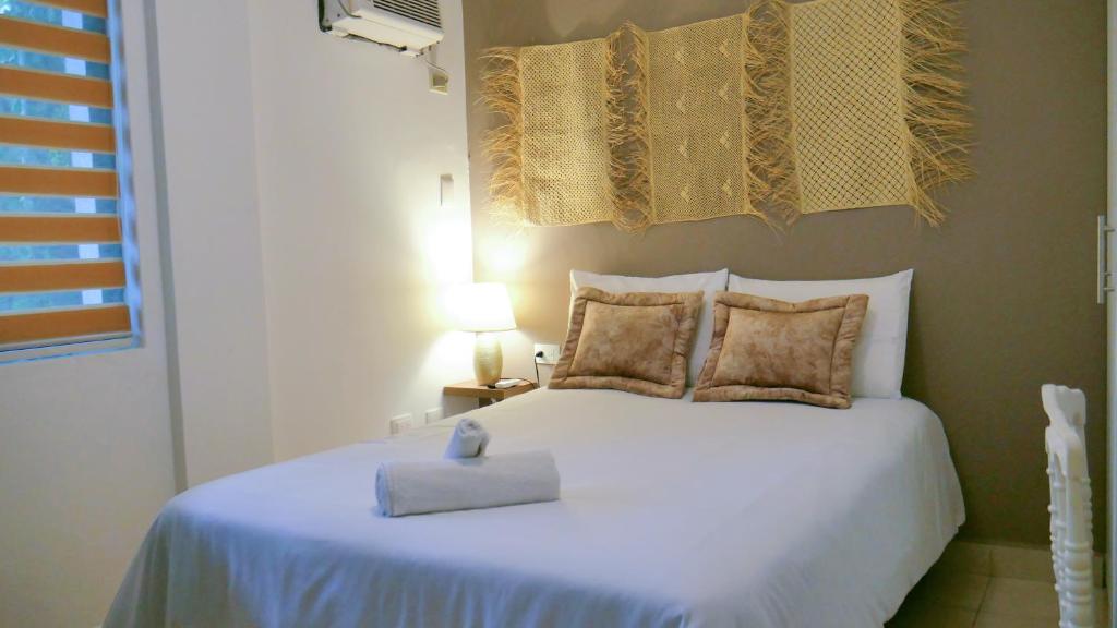 Postel nebo postele na pokoji v ubytování Park View Hostel & Suites