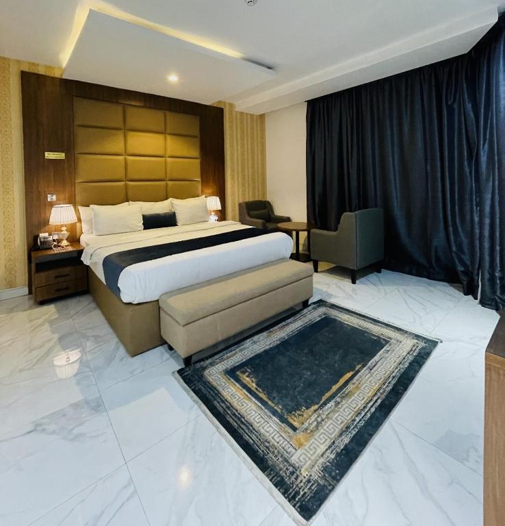 Postel nebo postele na pokoji v ubytování De Palms Hotel Port Harcourt