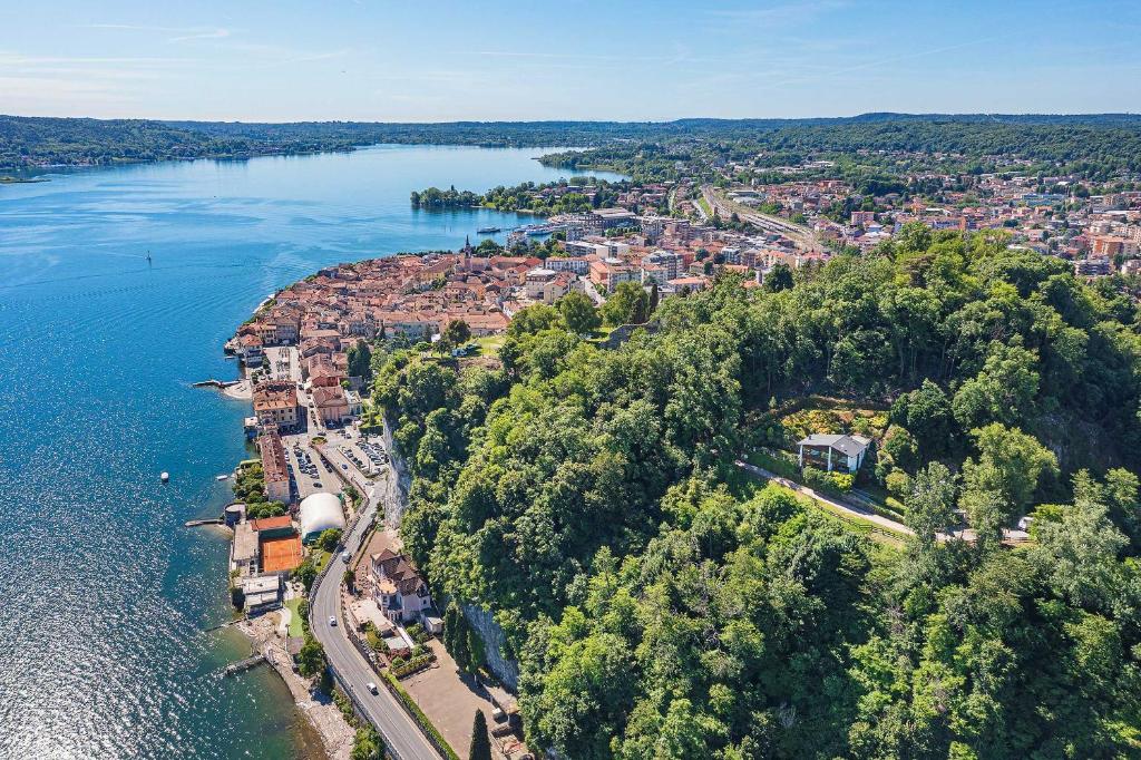 an aerial view of a city next to a body of water at Stylish villa & spectacular views! - Villa La Rocca in Arona