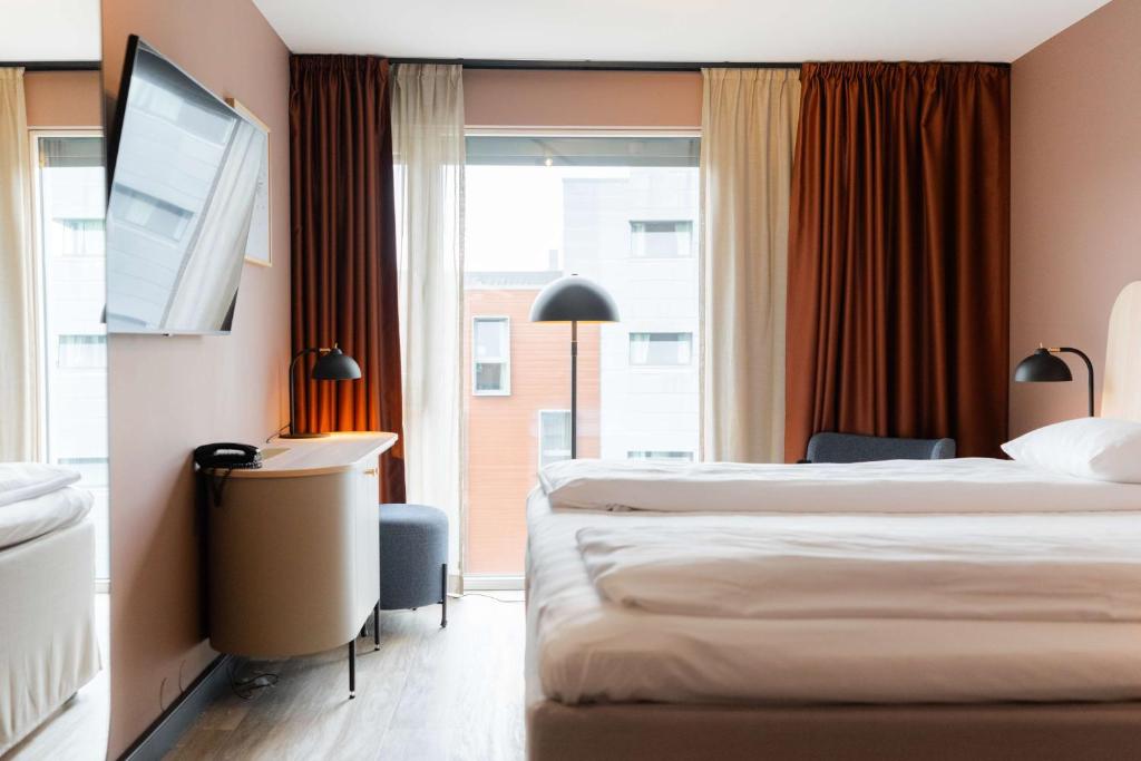 Postel nebo postele na pokoji v ubytování Scandic Nidelven
