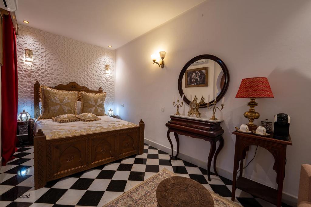 Postel nebo postele na pokoji v ubytování Riad dar chama