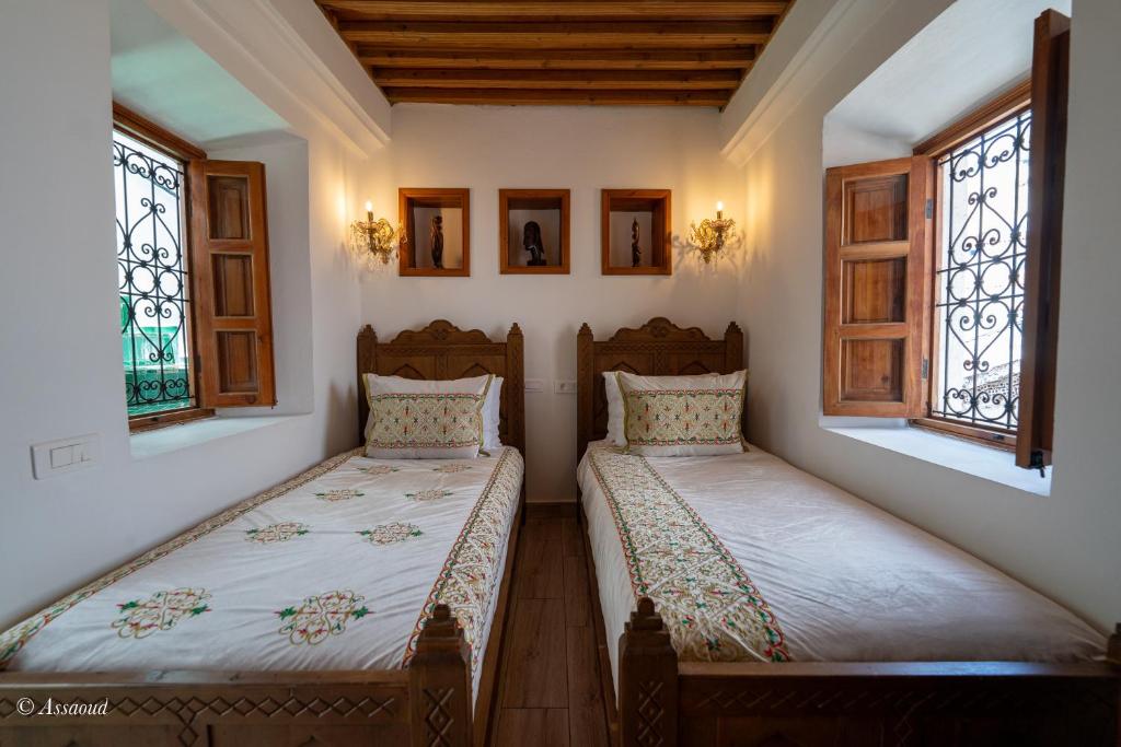 Postel nebo postele na pokoji v ubytování Riad dar chama