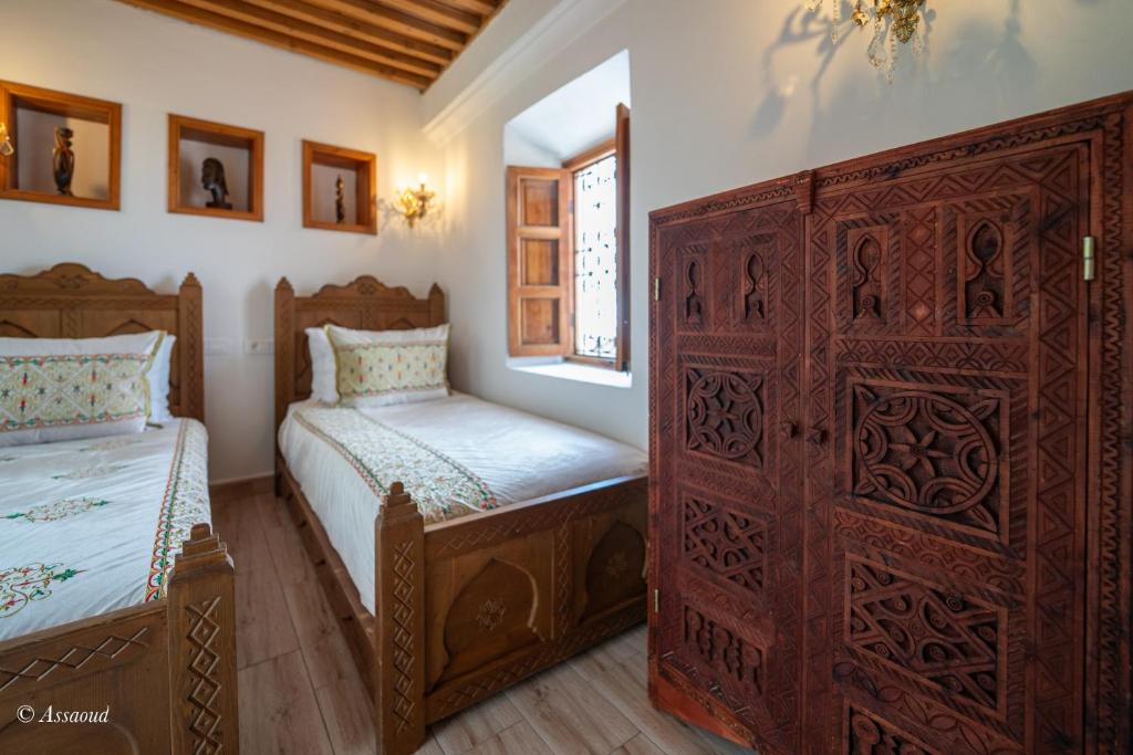 Postel nebo postele na pokoji v ubytování Riad dar chama