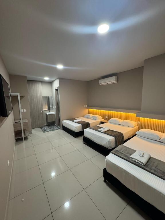 Letto o letti in una camera di HOTEL NABU VALLEDUPAR
